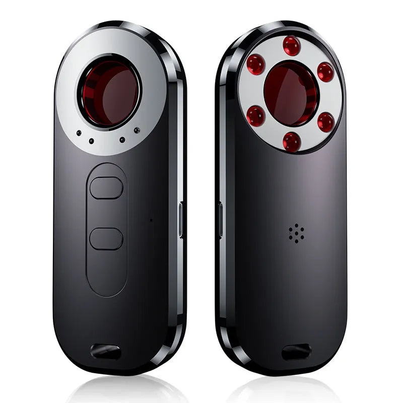 AK400 portable infrared anti-monitoring detector with USB cable on a table.