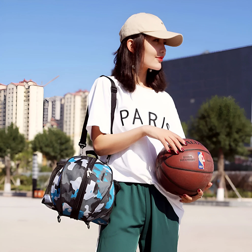 Black Oxford cloth basketball bag with a 9-litre capacity shown with both one-shoulder and two-shoulder strap options.