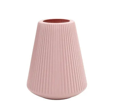 Melamine plastic decorative flower vase in blue colour on desktop