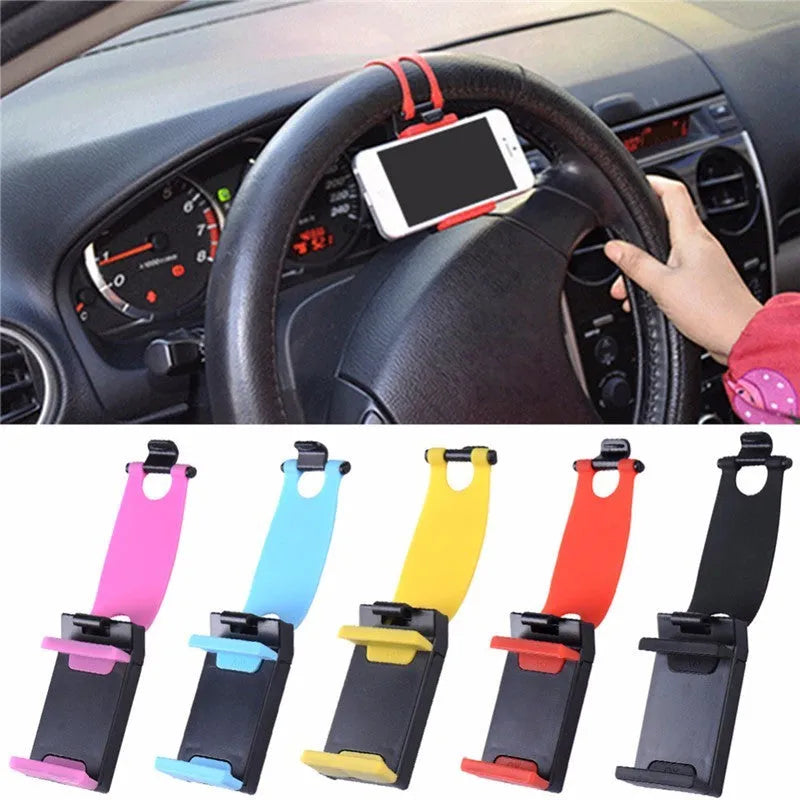 Black steering wheel phone holder clip mounted on car steering wheel holding a smartphone