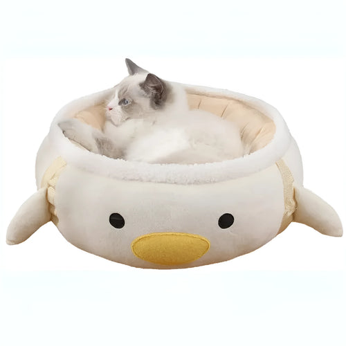 Green dinosaur-shaped cat bed with hanging straps that can be used flat or as a hammock