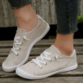 Women's creamy white casual sneakers with fabric upper and rubber sole on multiple surfaces