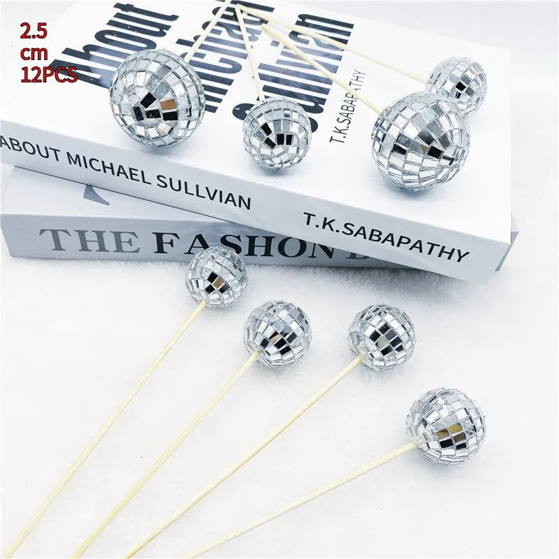 Glass disco ball cake decoration on a wooden stick, shown in different sizes for cake topping.