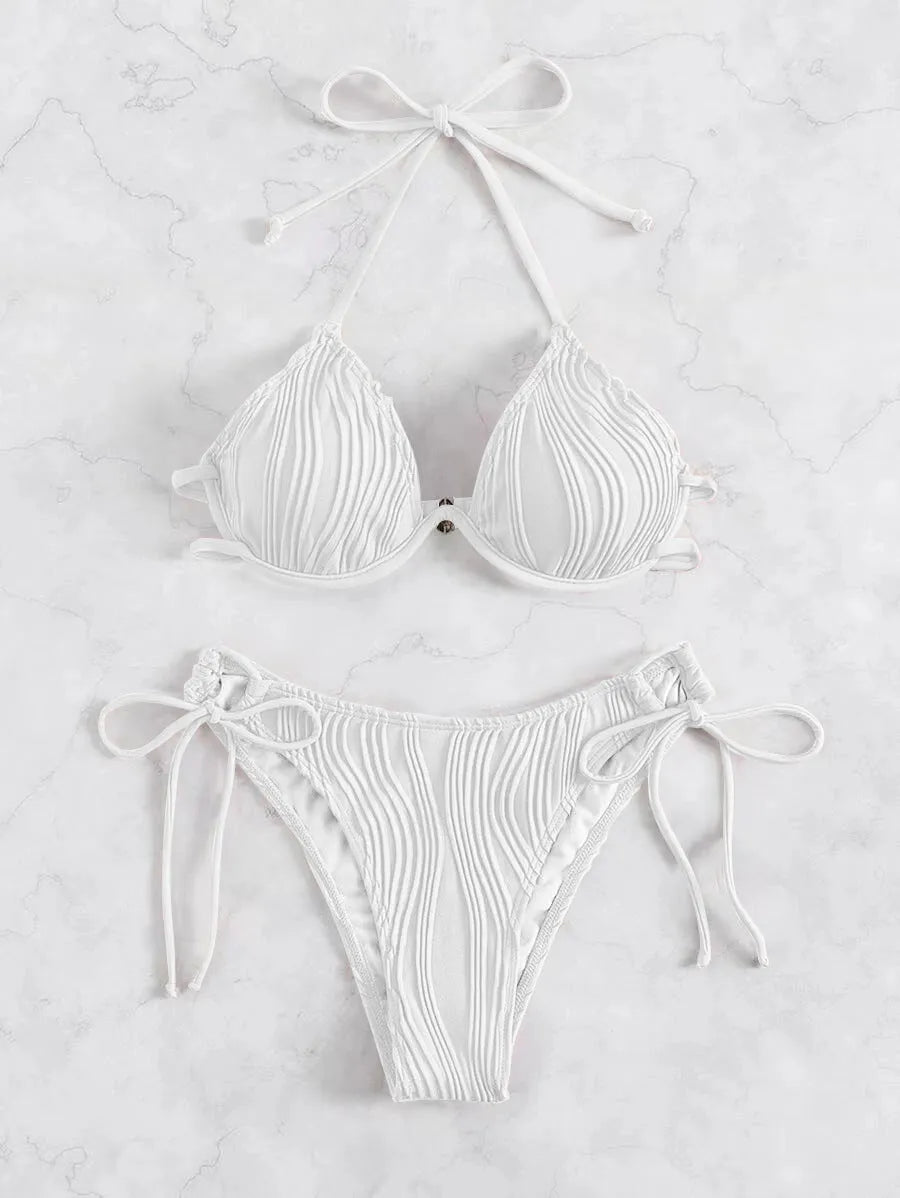 Women's apricot coloured underwire bikini swimsuit with adjustable side-tie bottoms on a mannequin.