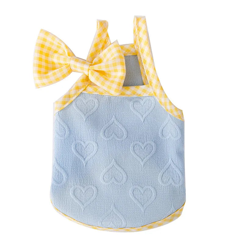 Small dog wearing heart texture elastic vest with bow suspenders in Bondi Blue colour