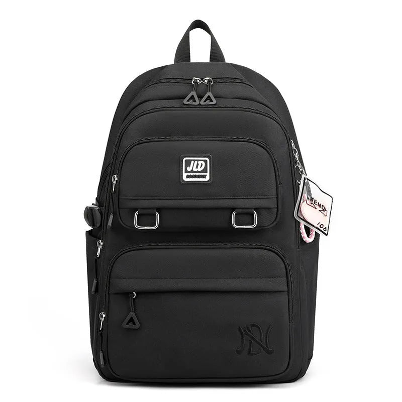 Large purple girls' nylon school backpack with a physiological curve backpanel on a white background.