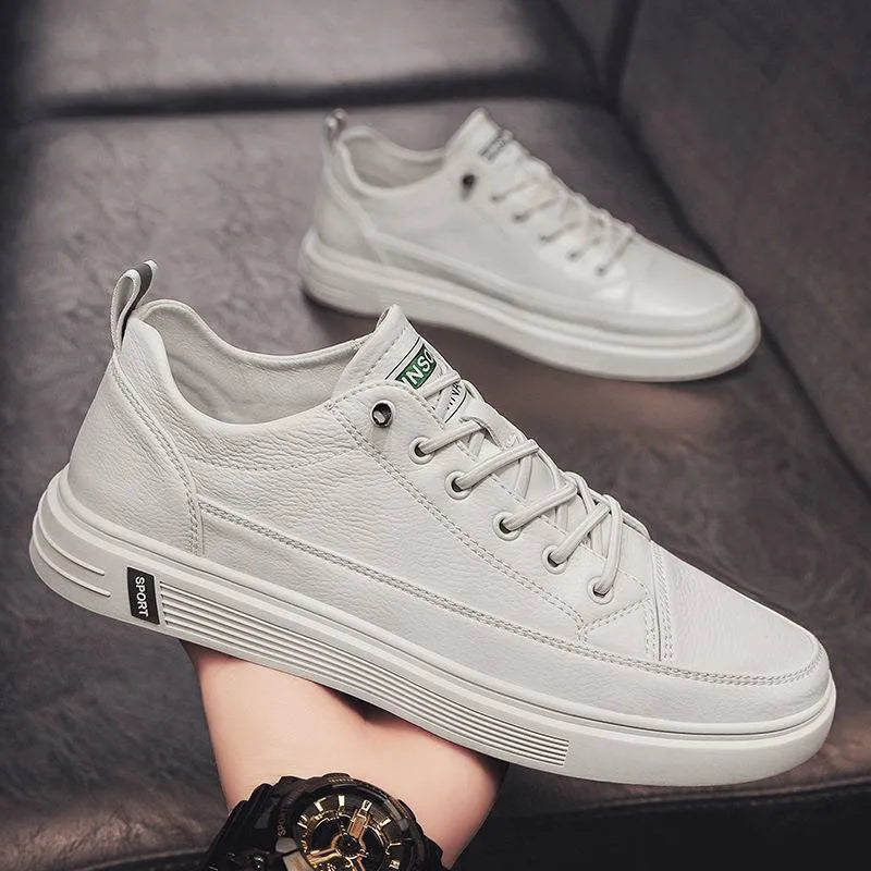 Men's white casual shoes with round toe, flat bottom, and shallow opening design