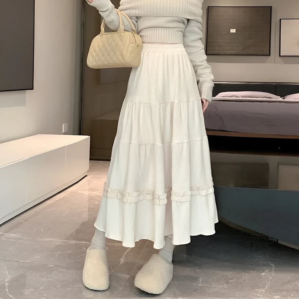 Women's milky white corduroy A-line midi skirt with an elastic waistband on a hanger.