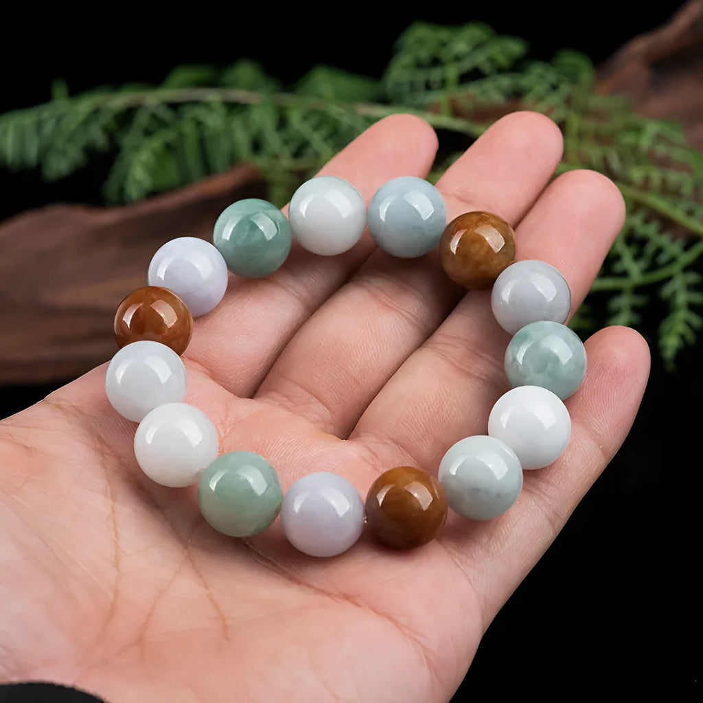 Women's Myanmar jade bracelet showing three-colour pattern on 13mm round beads.