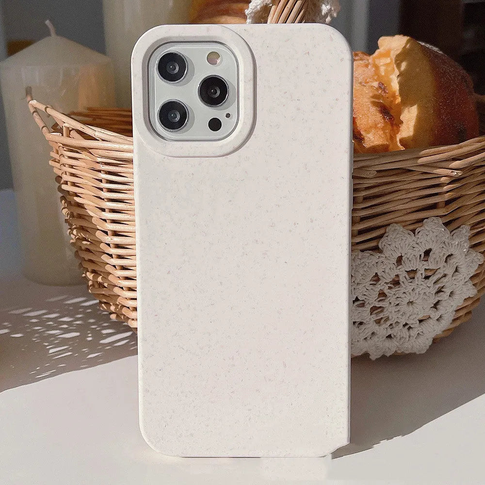 Fully degradable wheat straw bioplastic rear cover case for Apple iPhone on a table, shown in one of seven available colours.