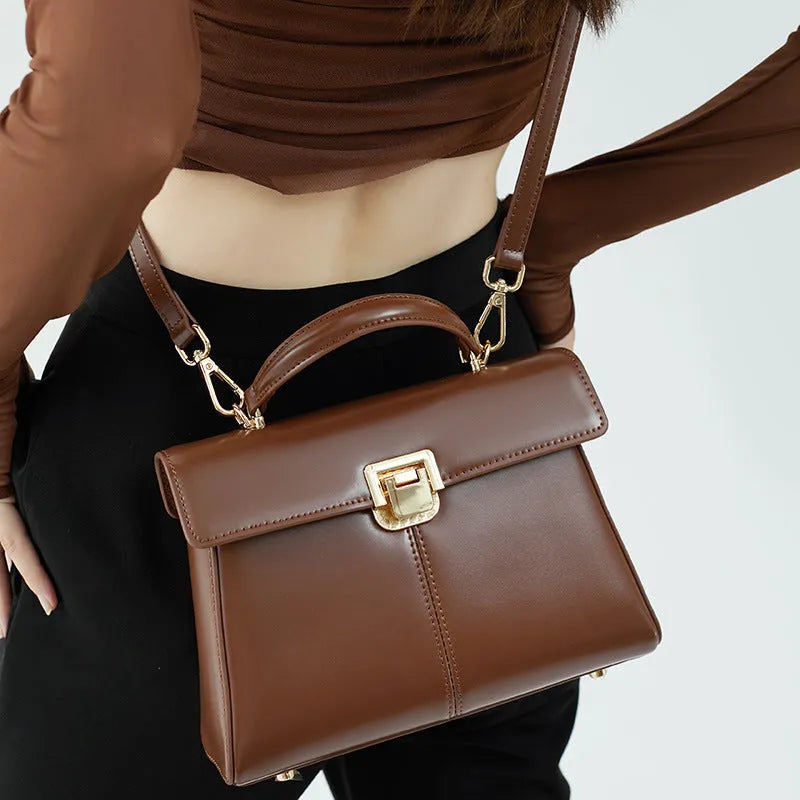 Women's black genuine leather shoulder handbag with vachette clasp in horizontal square shape