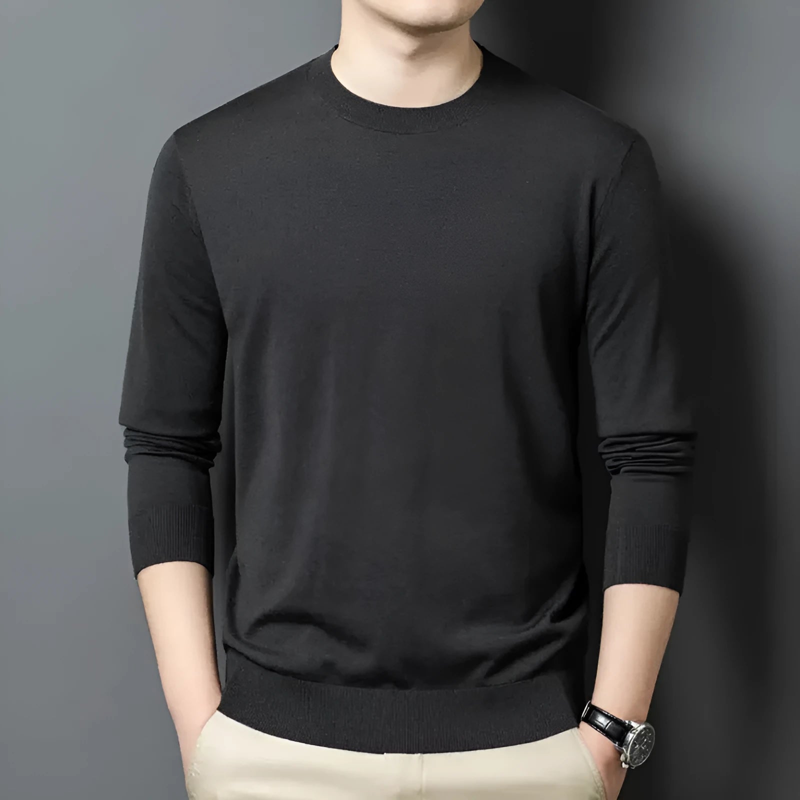 Men's round neck grey wool blend pullover sweater with long sleeves on a hanger.