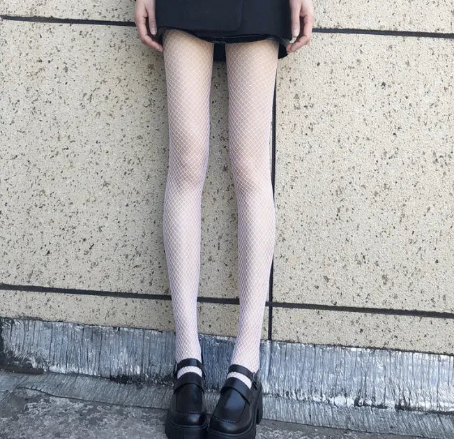 Women's mesh stockings showing large, medium, and small net patterns in black and white.