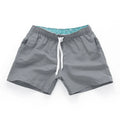 Men's straight leg beach shorts in multiple colours, made from polyester fabric, shown on size chart from S to 4XL.