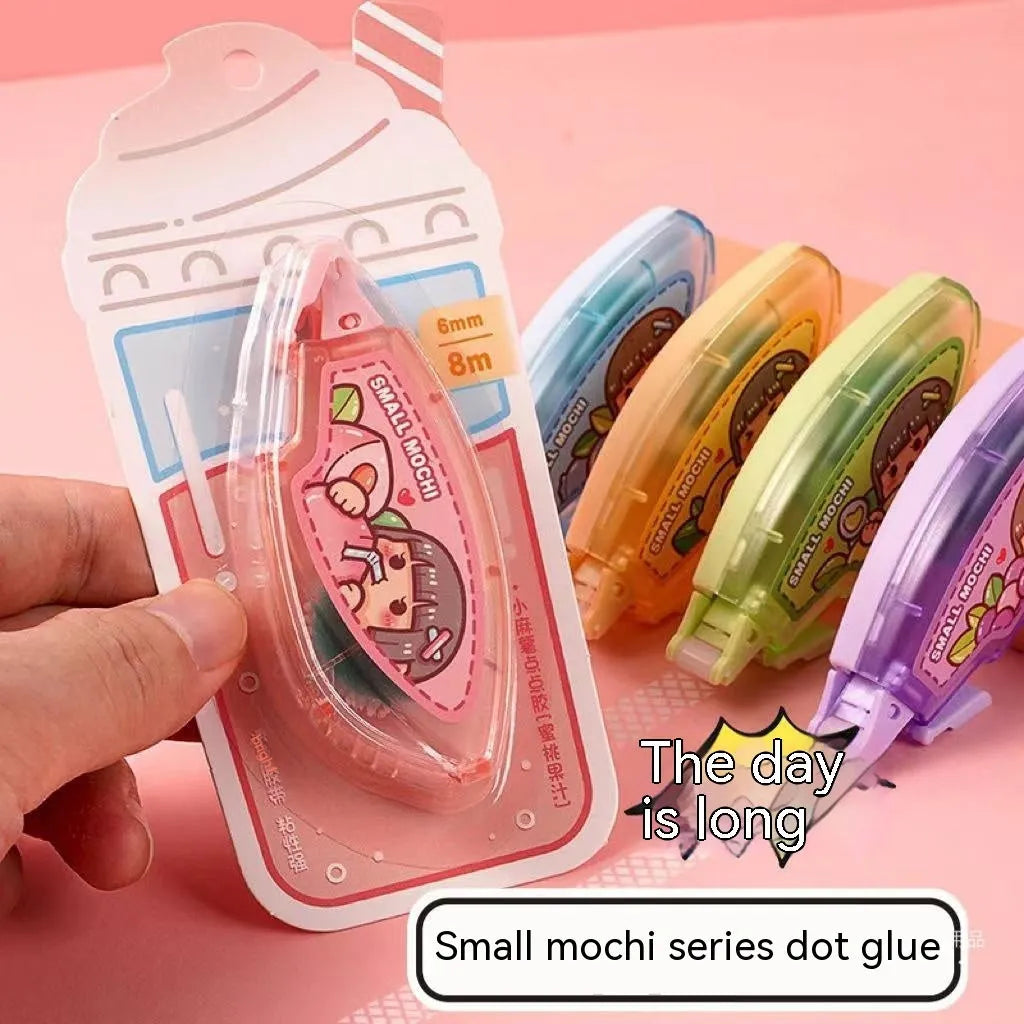 Dotting glue applicator in peach juice colour on a card, a high viscosity traceless adhesive for crafts.