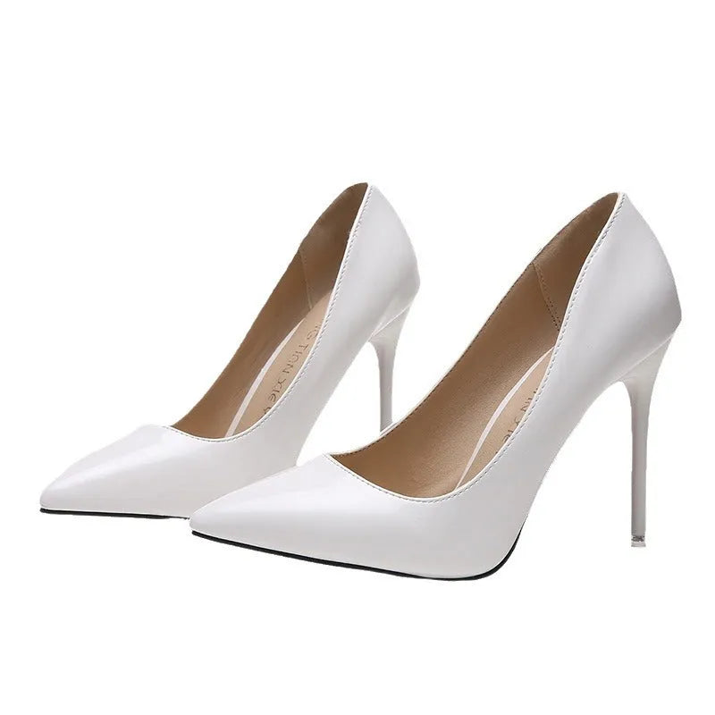 Women's pointed toe pumps with a high stiletto heel in apricot colour on a rubber sole.
