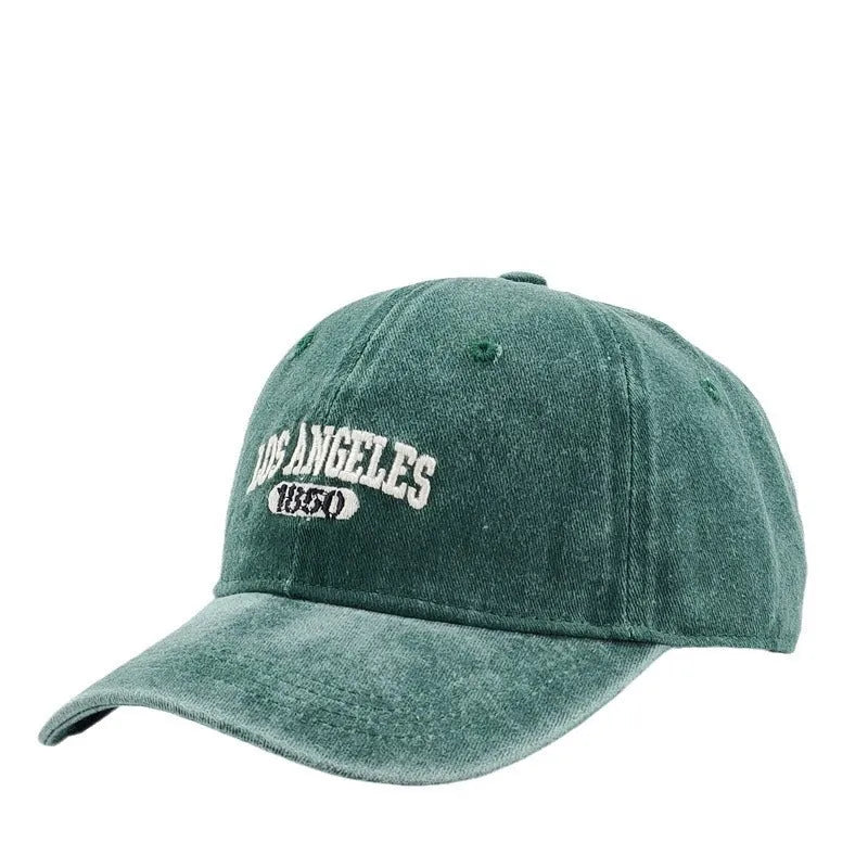 Retro adjustable peaked cap with distressed embroidery in conical crown design