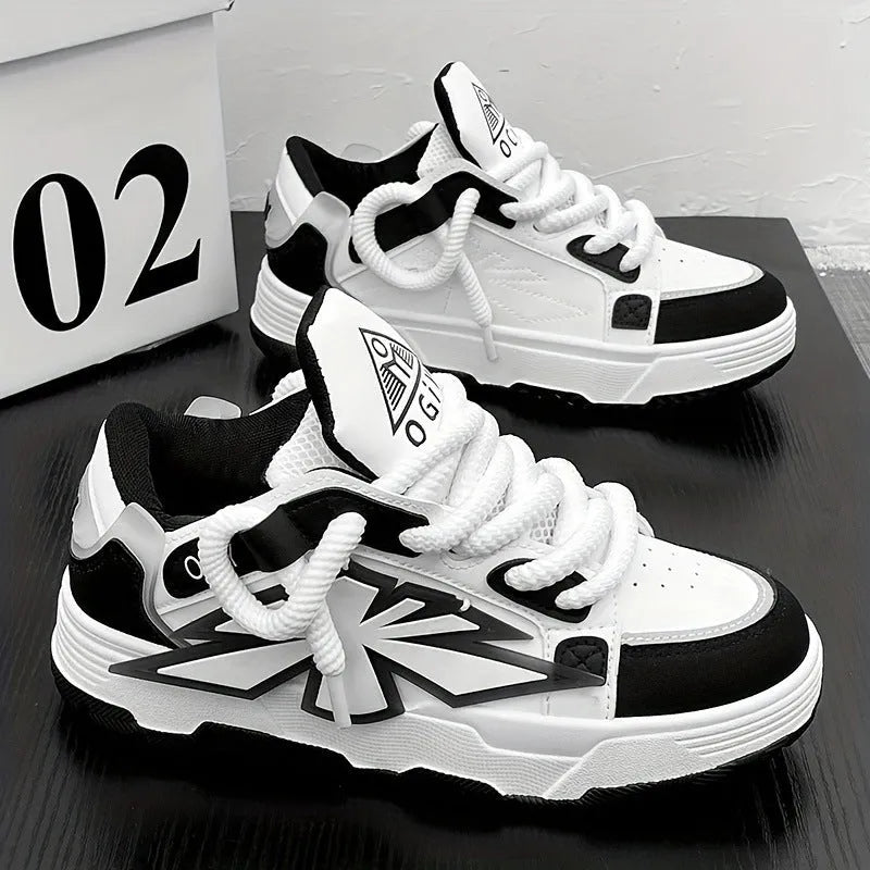 Men's white chunky sneakers with a cartoon totem pattern on the synthetic leather upper and a thick rubber sole.