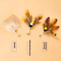 Three steel wire cat toy replacement heads in a small flying insect design on a white background.