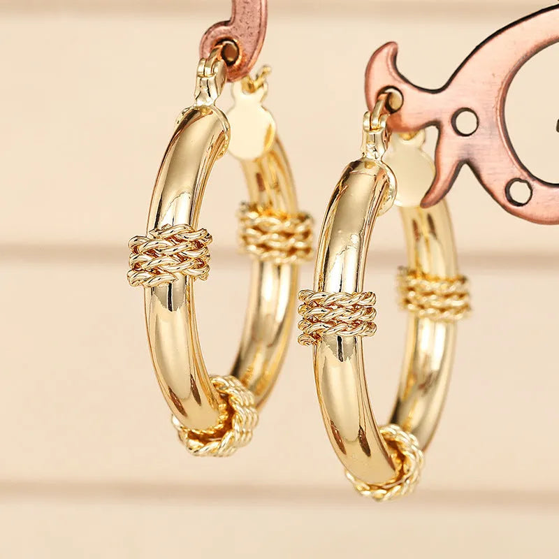 Geometric copper ear clips with ring design in golden colour for women