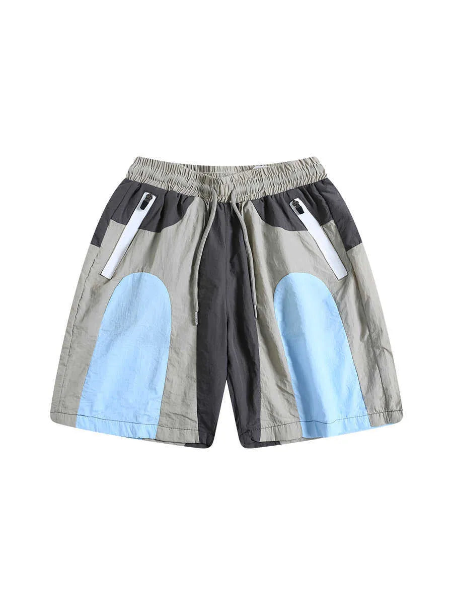 Blue patchwork outdoor sports shorts with loose straight-leg design and quick-drying fabric