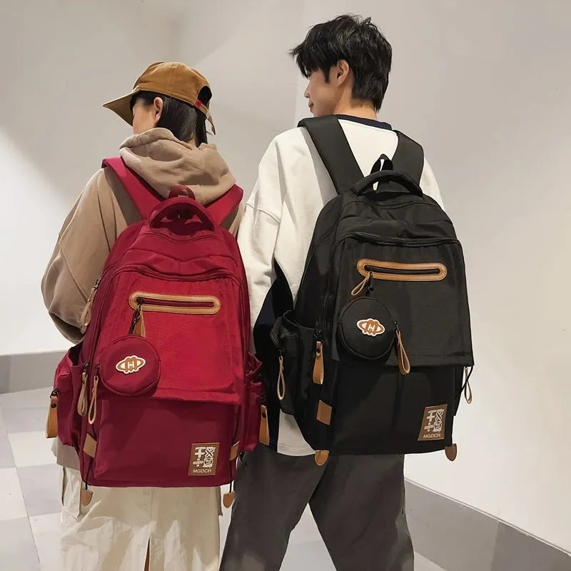 Large-capacity black nylon school backpack for junior high students with curved shoulder straps