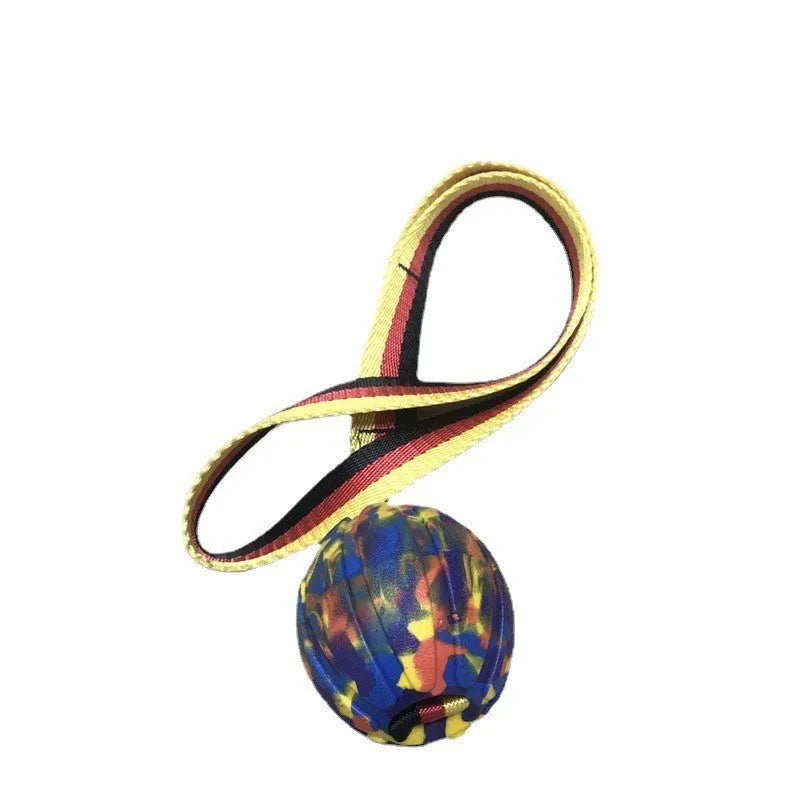 Camouflage and yellow floating EVA dog balls with tether strings in three different sizes on blue background.