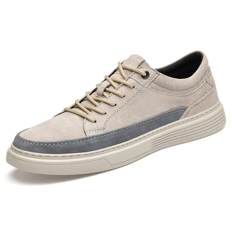 Men's gray casual skate shoes with pigskin leather upper and rubber sole on a white background.
