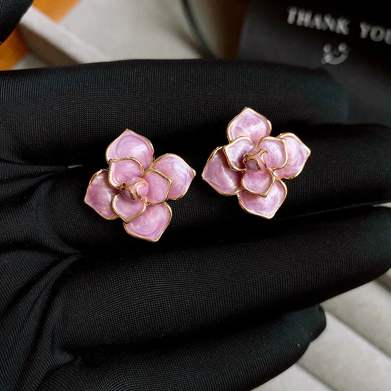 Gold plated copper stud earrings with purple oil-spot glaze flower decorations