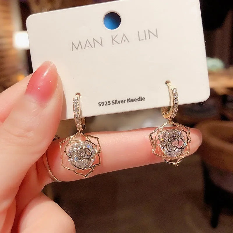 Women's zircon earrings with electroplated finish in geometric rose designs on copper
