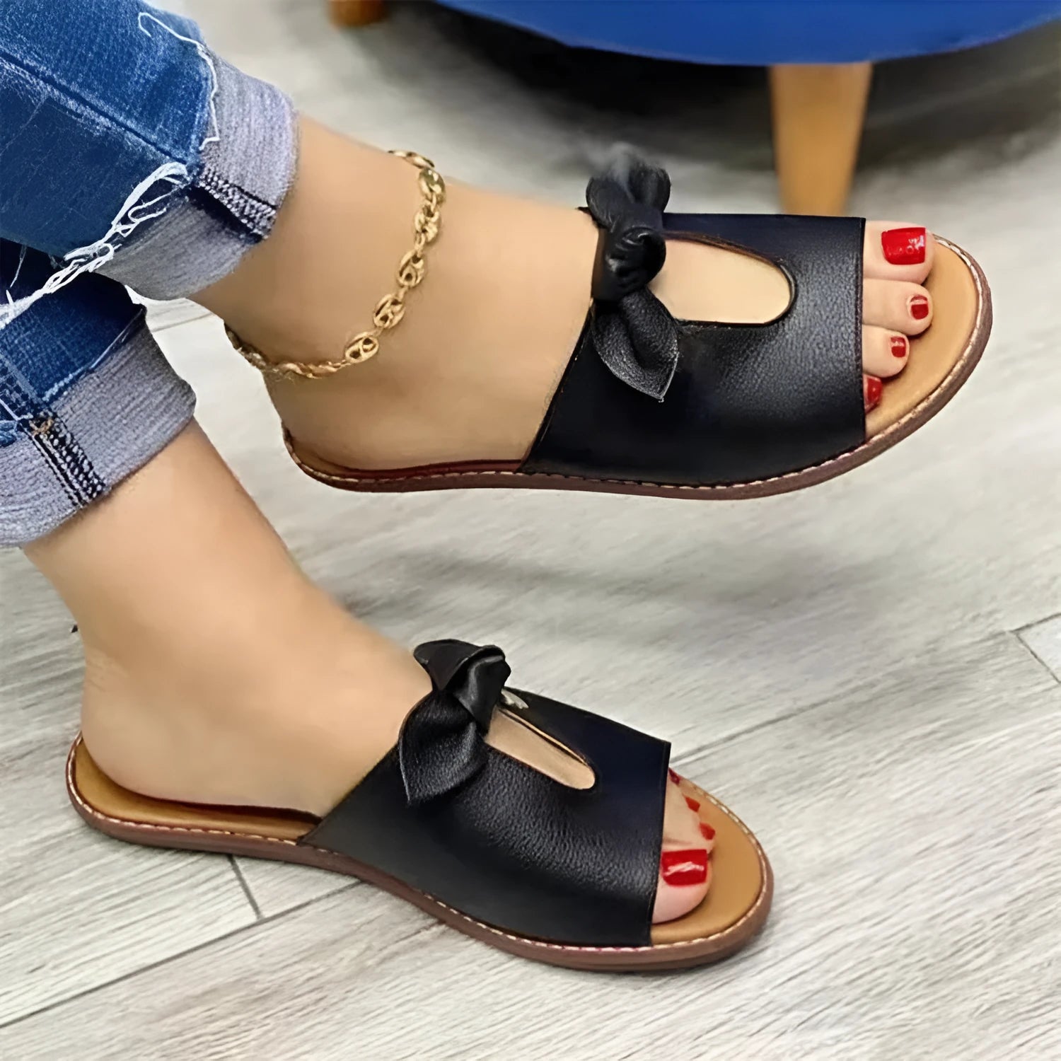 Ladies casual sandals with bow decoration and fish mouth toe opening in black, pink, and gold colours.