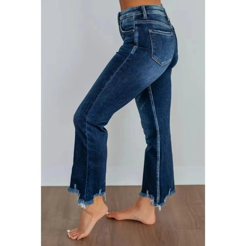 Women's dark blue cotton denim jeans with hand-distressed detailing and casual styling