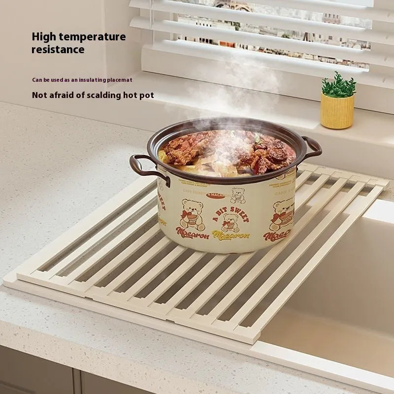 Foldable stainless steel kitchen draining rack in milky white finish showing tri-fold mechanism