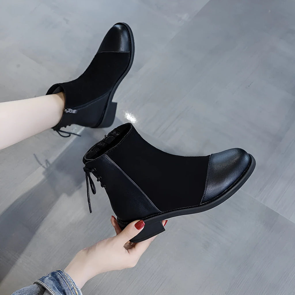 Black women's knee-high soft leather martin boots with side zip and bow detail.
