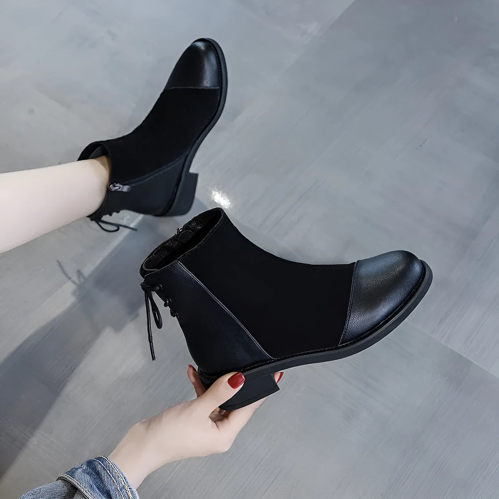 Black women's knee-high soft leather martin boots with side zip and bow detail.