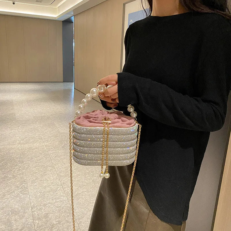 Women's retro style crossbody handbag with beaded pearl details on soft PU leather in a choice of colours.