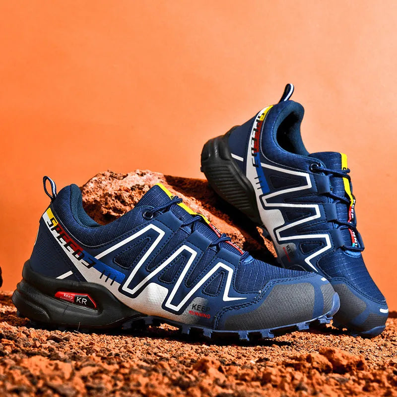 Men's low-top casual running shoe in synthetic leather with mesh lining, shown in grey orange colourway.
