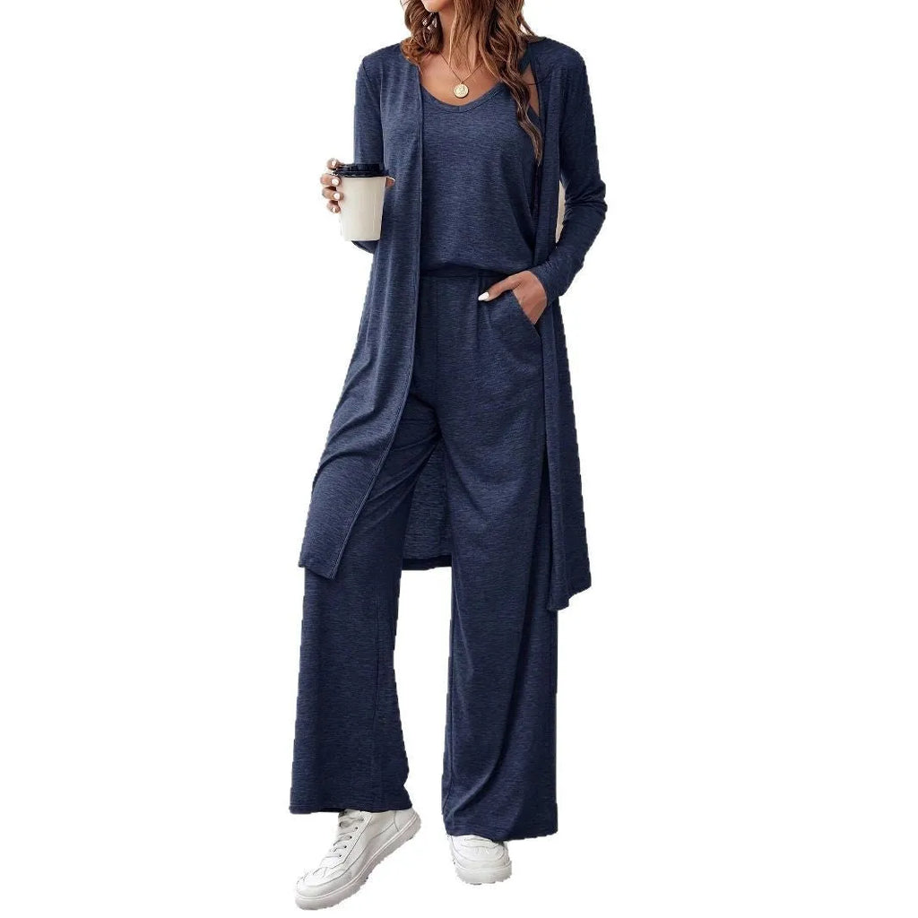 Blue three-piece women's suit set with long sleeve top and trousers in solid color