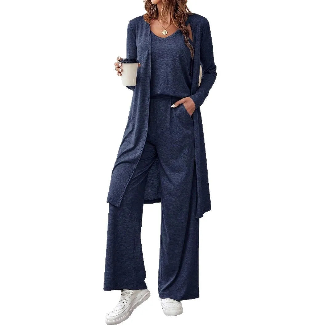 Blue three-piece women's suit set with long sleeve top and trousers in solid color