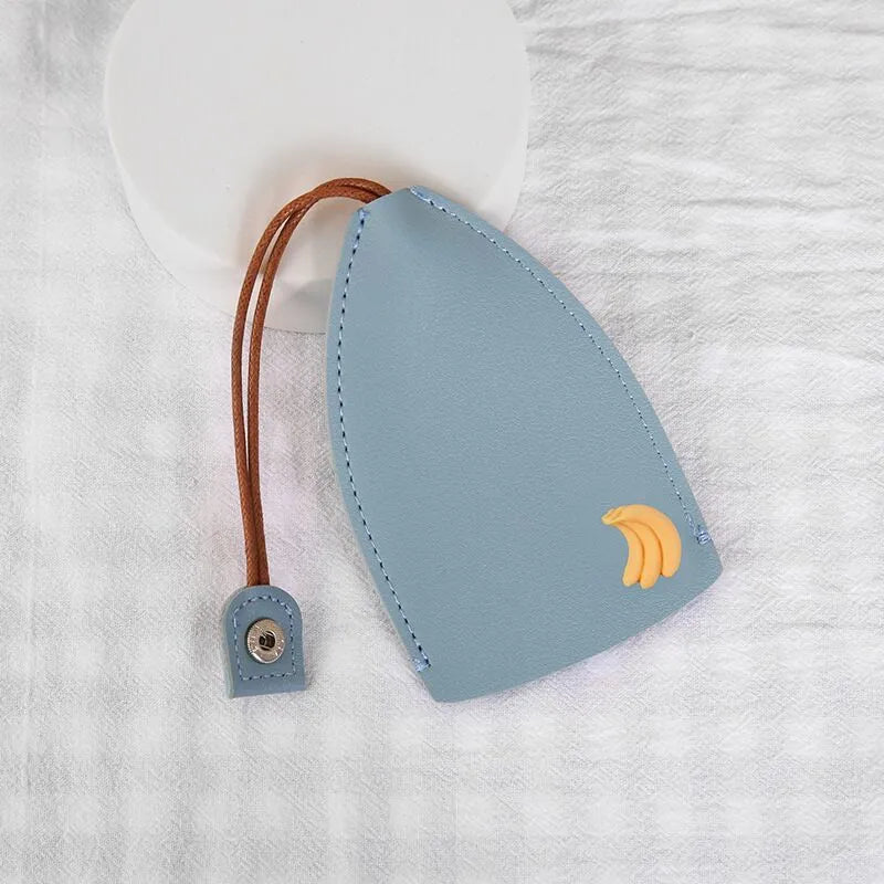 Cartoon pull-out car key case in PU leather with colourful designs measuring 14 x 7.5 cm