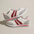 Red and blue low-top lace-up casual sneakers with a round toe and rubber sole.