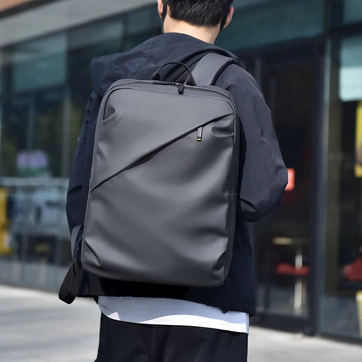 Men's waterproof backpack in black colour made from PU leather with large capacity design