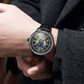 Men's mechanical watch with transparent case back showing movement and stainless steel strap