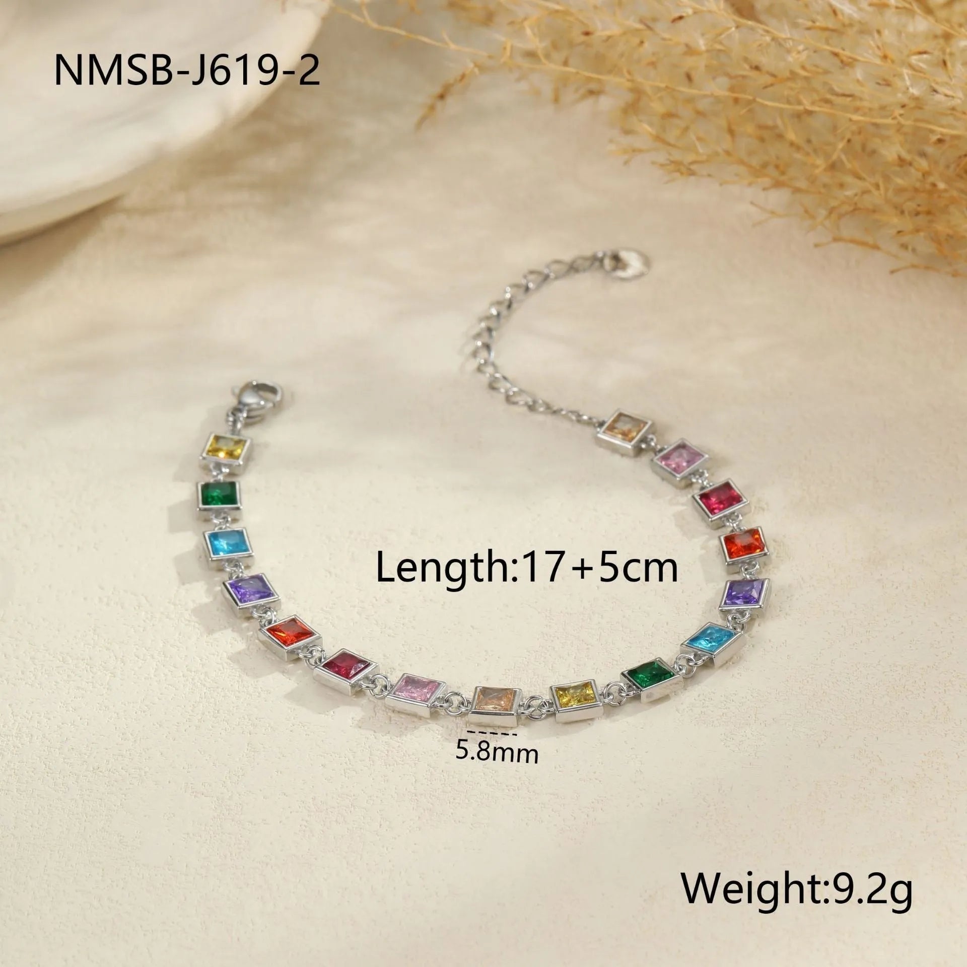 Gold and silver electroplated stainless steel bracelet with square, heart, and round geometric designs