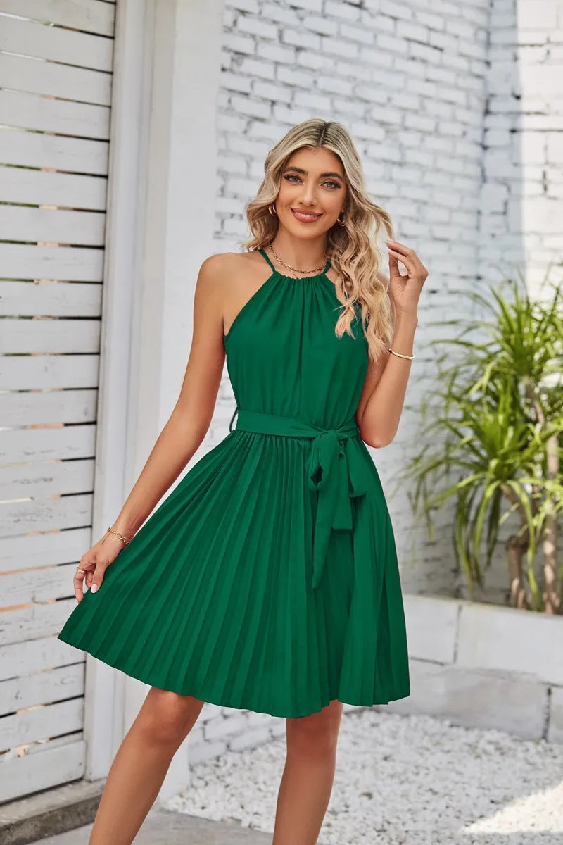 Women's black halter neck strapless dress with pleated midi skirt and waist belt