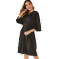 Women's black elastic waist A-line dress with cinched belt and long sleeves