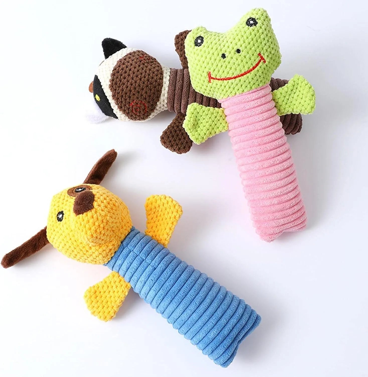 Soft plush dog chew toy in animal shape with squeaker, shown with size scale.