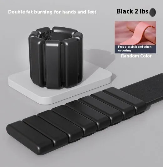 A black silicone weight-bearing bracelet with Velcro fastening, shown with 1lb and 2lb weight options.