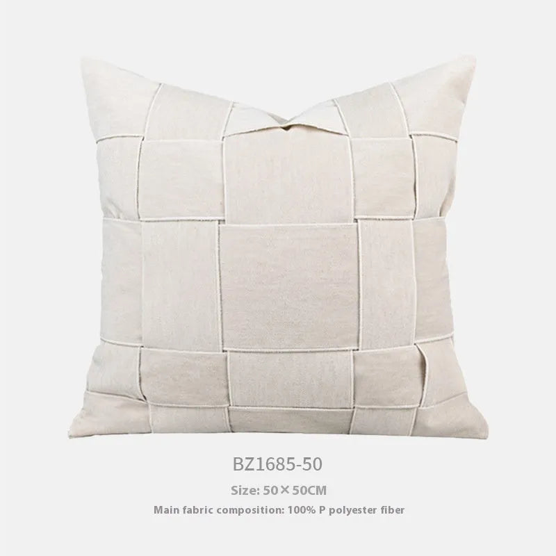 Chenille woven square pillow cushion in beige colour on a sofa