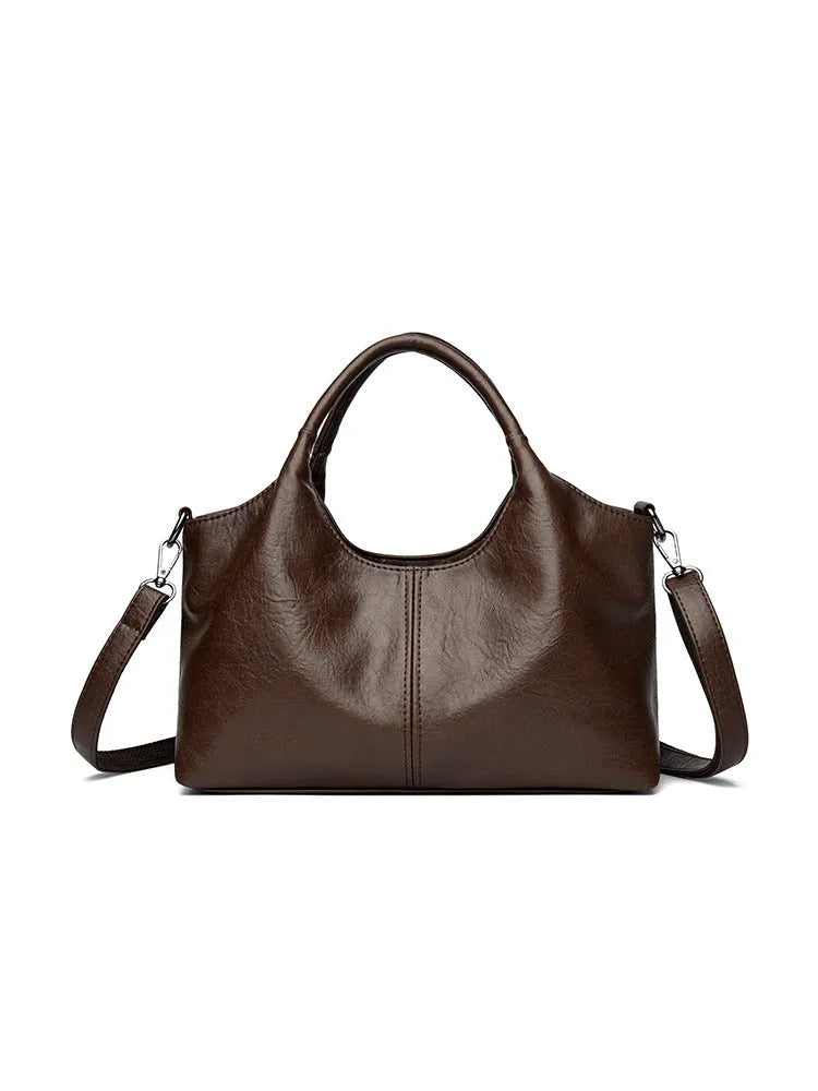 Genuine leather women's cross-body bag in a choice of seven colours including black, brown, and wine red